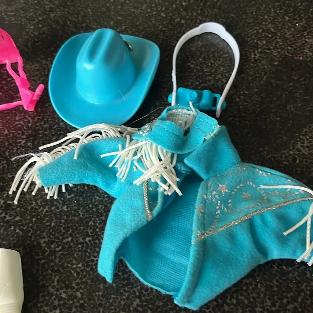 Vintage 1990s Barbie doll bundle of accessories. Gown, rodeo, Baywatch, skater.